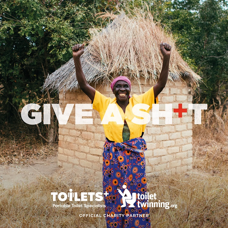 Happy woman standing in front of toilet