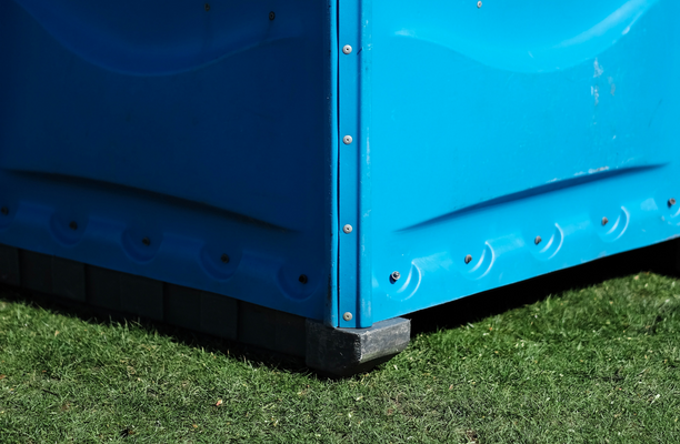 portable toilet on grass